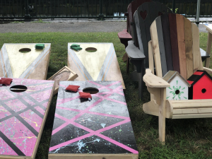 corn holes adirondack chairs and bird houses made by YB for sale at Farmers Market