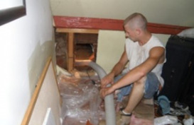 man doing electrical work in home