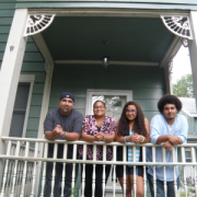 family standing on porch