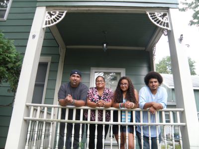 family standing on porch