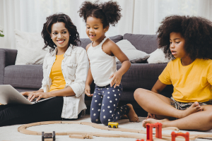 mom working from home with two little girls